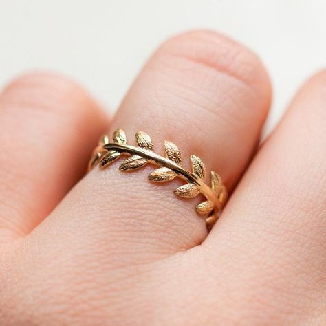 A symbol of infinite love, eternity bands date back to ancient Egypt.  This stunner features a solid gold laurel leaf design and is textured by hand for a gorgeous, realistic look. 14k solid yellow gold Band width 7 mm Gold Ring Indian, Making Jewelry For Beginners, Ruby Wedding Rings, Local Eclectic, Laurel Leaf, Jewelry Set Design, Infinite Love, Gold Rings Fashion, Gold Ring Designs