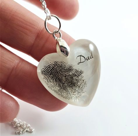 Current production time is 10 to 15 business days from the moment we receive a copy of the paw print or fingerprint. Beautiful bespoke pendant made with your loved one's fingerprint. It will make a wonderful keepsake that you will treasure forever.  To add a fingerprint, we will need an image on white background sent to our email address after placing your order. We will contact you to discuss all the details and customisation.  Each order is beautifully and lovingly packaged in our branded gift Loss Of Mum, Resin Keepsake, Heart Fingerprint, Hair Keepsake, Memorial Jewelry Ashes, Fingerprint Necklace, Memory Crafts, Resin Jewelry Diy, Fingerprint Jewelry