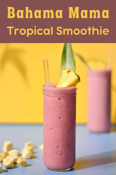 A red smoothie in a tall glass with a piece of pineapple and a pineapple leaf on top. Tropical Smoothie Bahama Mama Recipe, Bahama Mama Smoothie Recipe, Bahama Mama Smoothie, White Chocolate Coconut, Tropical Smoothie Recipes, Lemonade Smoothie, Tropical Smoothie Cafe, Chocolate And Coconut, Fruit Smoothie Recipes Healthy