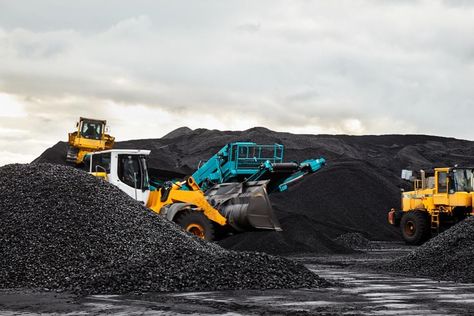 Caterpillar tractors collect black coal pile. Illustration of supply field of a power station.... [+] Credit: Getty Generating Power, Green Economy, Coal Plant, Carbon Sequestration, National Grid, Power Out, Offshore Wind, Renewable Sources, Wind Farm