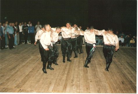 Art: Shown above is a group of men doing the dabke, a dance done in Lebanon during the Baalbeck International Festival. The dance involves a group of people standing in a line holding handkerchiefs. There is a lot of complicated footwork. Maya Harris, Dabke Dance, International Festival, A Group Of People, Group Of People, People Standing, The Middle East, The Dance, The Culture