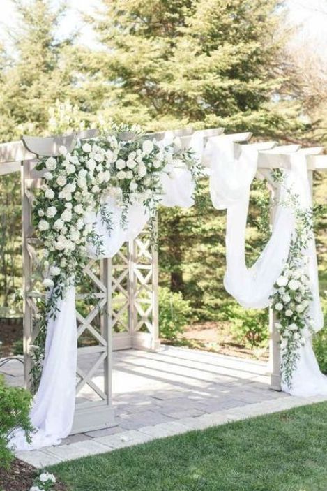 Pergola Wedding Decor, Outdoor Wedding Ceremony Arch, Draped Ceremony Arch, Greenery Wedding Arch |  #pergola #weddingceremony White Pergola Wedding Decorations, White Pergola Wedding, Ceremony Arch Greenery, Pergola Wedding Ceremony, Closed Pergola, Pergola Wedding Decorations, Greenery Wedding Arch, Simple Pergola, Arch Greenery