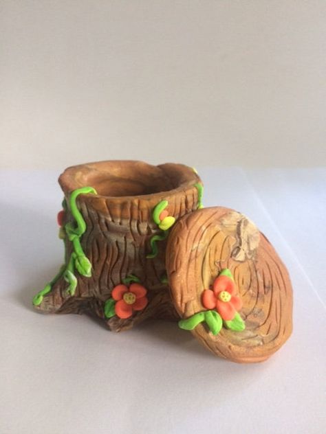 This handmade polymer clay Tree stump box, jewelry box, woodland box, peach flowers and green vines, perfect perch for a gnome or fairy, multicolored  Browns, not a toy, hold rings, and earring holder, secret container., one of a kind, fantasy, mint greens, all handmade, miniature art, collectible,fun my own creation.can hang anywhere not just on a Christmas tree.  One of a kind no molds or painting done on figurine she is cooked in the oven.  A final light coat glaze is used to give bit of shin Polymer Clay Useful Projects, Oven Bake Clay Jewelry Holder, Fairy Clay Ideas, Cute Clay Containers, Cute Clay Pencil Holder, Box Clay Ideas, Fairy Clay Art, Jewelry Box Clay, Clay Trinket Box Diy