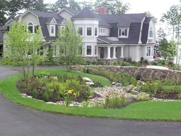 Feature Friday: An approachable approach to a casual landscape Circle Driveway Landscaping, Stone Entrance, Circle Driveway, Rock Landscape, Gambrel Roof, Driveway Landscaping, Front Yards, Circular Driveway, Easy Landscaping