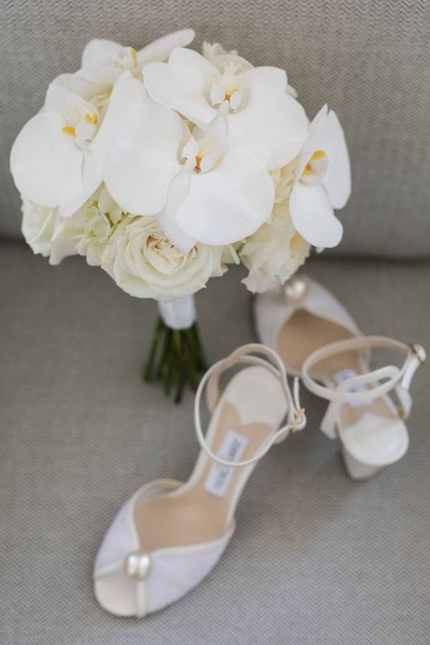 Round and classic white rose and white phalaenopsis orchid bridal bouquet. PC: Femina Photo + Design https://feminaphoto.com/ Orchid And Rose Bouquet, White Orchid Bouquet, White Phalaenopsis Orchid, Orchid Bridal Bouquets, White Dendrobium Orchids, Orchid Bouquet Wedding, Ritz Carlton Wedding, Cascading Bridal Bouquets, Orchid Bouquet