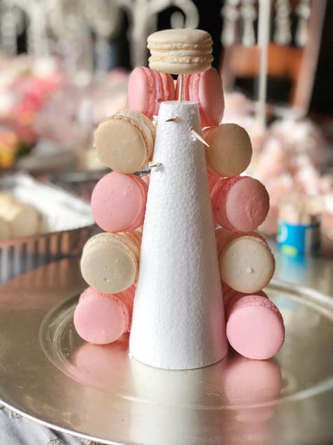 Place toothpicks. Ever wondered how to make a Macaron Tower? Try your hand at DIY-ing this simplified small French wedding tower. Dress your cookies up with ribbon and flowers in any color combination. These pastel pink and white macarons are perfect for Valentine's, Baby shower, or birthday party. Follow the simple tutorial at PartiesWithACause.com #macarontower #macarons #partyfood #prettyfood Macaron Presentation Ideas, Peonies Bridal Shower Theme, Macaron Tower Cake, Macaroons Tower, Macarons Decoration, Fake Macarons, Macarons Tower, White Macarons, Macaron Stand