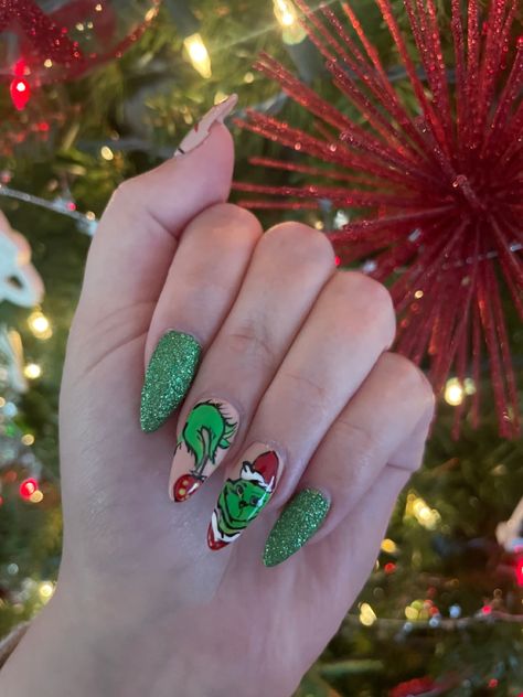 Grinch Acrylic Almond Christmas Nails green glitter Grinch Christmas Nails, Almond Christmas Nails, Christmas Nails Green, Medium Almond Nails, Grinch Nails, Medium Almond, Nails Green, Grinch Christmas, Green Glitter