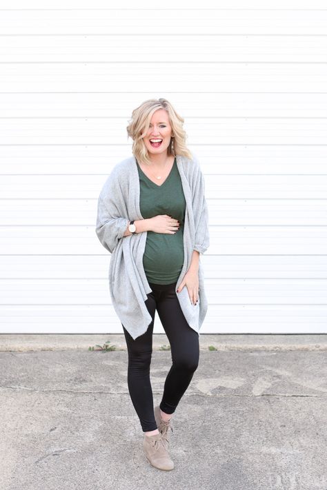 Thanksgiving is a tough holiday to dress for. You want to be comfortable to accommodate all of the food you're going to eat..but you also want to be cute! Here's a cute maternity outfit for the holiday. Black leggings and a blanket wrap, plus cute booties. #maternityclothes Comfy Maternity Work Outfit, Winter Maternity Outfits Leggings, Plus Maternity Outfits, Thanksgiving Outfit Pregnant, Thanksgiving Pregnancy Outfit, Pregnant Thanksgiving Outfit, Thanksgiving Maternity Outfit, Holiday Maternity Outfits, Maternity Thanksgiving Outfit