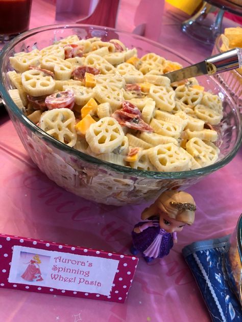 Spinning wheel pasta salad make a perfect side dish for a Disney Princess themed birtjday party. Sleeping Beauty Snack Ideas, Princess Party Appetizers, Royal Party Food Ideas, Royal Fiveness Birthday Party Food, Disney Princess Themed Party Food, Disney Princess Birthday Food Ideas, Disney Princess Birthday Food, Sleeping Beauty Food Ideas, Princess Theme Food Ideas