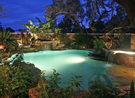 Tropical waterfall backyard pool idea. | 11 of the Best Backyard Swimming Pools We've Ever Seen Backyard Patio Landscaping, Pool With Waterfall, Pools And Hot Tubs, Amazing Pools, Best Pools, Natural Swimming Ponds, Relaxation Station, Pool Design Ideas, Above Ground Pool Landscaping