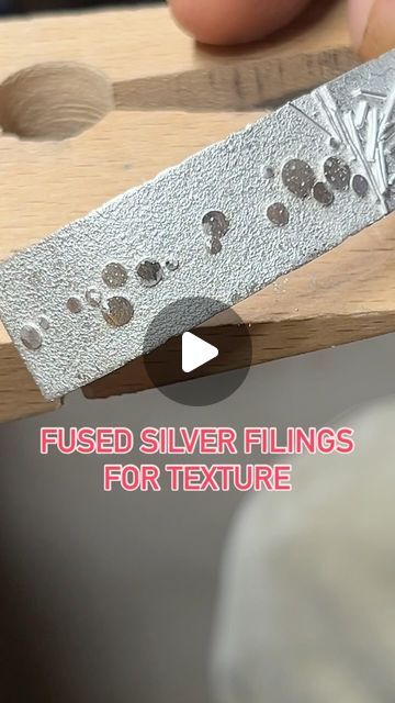 Robert Lopez on Instagram: "Texture Time!!!  Quick demo of fused silver filings on a sheet of Argentium Silver Sheet. This will be the base for a cuff I’m working on.   Most people use saw filings that they catch and save but I don’t saw that much, soooooo I found this key duplicator that I use to make a fat pile of silver filings in minutes.   #metalsmith #silversmith #handmadejewelry #artisanjewelry #instajewelry #fusedsilver #argentium #silvercuff #contemporaryjewelry #metalsmithing #jewelry @pepetools_usa" Texturing Metal For Jewelry, Beginner Silversmithing Projects, Silversmithing Jewelry Ideas, Metal Smithing Jewelry, Silver Smithing Jewelry, Silversmith Techniques, Silversmithing Tutorials, Metal Tutorial, Jewellery Techniques