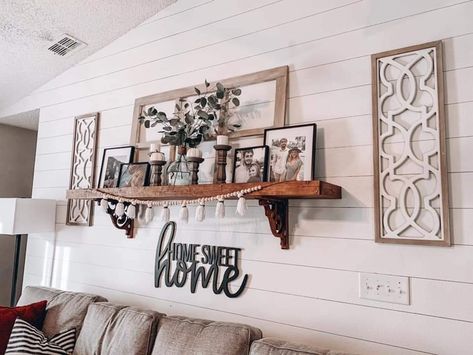 Floating Shelves Living Room Long Wall, Decorating Around Windows Living Rooms, Modern Farmhouse Artwork Wall Decor Living Room, Shutter Wall Decor Ideas Living Rooms, Western Boho Shelf Decor, Shelf Decor Above Couch, Above The Couch Art, Farmhouse Floating Shelves Living Room, Behind Couch Wall Decor Farmhouse