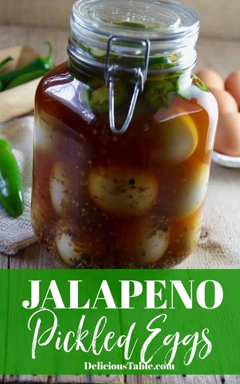 Large clamp jar filled with pickled eggs with Jalapenos. Pickled Egg Recipes Spicy, Jalapeno Pickled Eggs, Jalapeno Pickled Eggs Recipes, Hot Pickled Eggs Recipe, Jalapeño Pickled Eggs, Cajun Pickled Eggs, Best Pickled Eggs Recipes, Buffalo Pickled Eggs Recipe, Old Fashioned Pickled Eggs Recipe