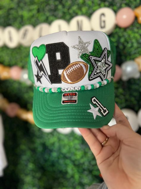 Friday Night Lights hair? Don't care!  Every football mom needs one of our custom trucker hats to wear on Friday nights. I also have different colored footballs, baseballs, softballs, soccer balls, hockey sticks, volleyballs and basketballs!   All our hats are totally customizable, so message us to request custom colors or patches. We can build a custom listing just for you! Football Mom Trucker Hats, Football Accessories Ideas, Football Trucker Hat With Patches, Ball Cap Design, Trucker Hats With Patches, High School Spirit, Hat Chain, Football Moms, Hat Bar