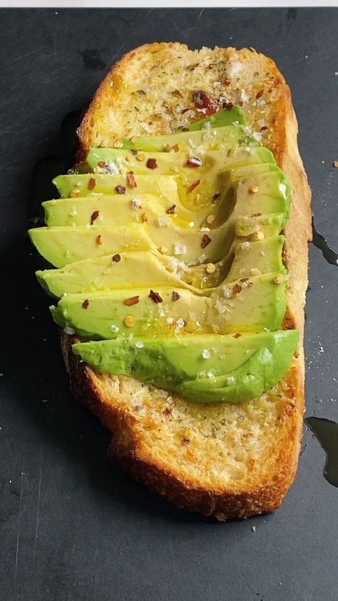 sweatspace on Instagram: Garlic Avocado Toast Sourdough bread topped with roasted garlic, butter, salt, pepper, oregano, parsley, basil, red pepper flakes, evoo… Toast Sourdough, Roasted Garlic Butter, Toasted Sandwiches, Grilled Sandwiches, Honey Toast, Amazing Food Videos, Toast Sandwich, Grilled Sandwich, Breakfast Toast