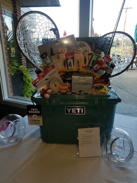 Western Silent Auction Ideas, Gone Fishing Gift Basket Ideas, Cooler Gift Basket Ideas Wedding, Cooler Silent Auction Basket, Fishing Raffle Basket Ideas, Big Raffle Prize Ideas, Yeti Cooler Raffle Basket Ideas, Sports Raffle Basket Ideas, Outdoor Gift Basket Ideas