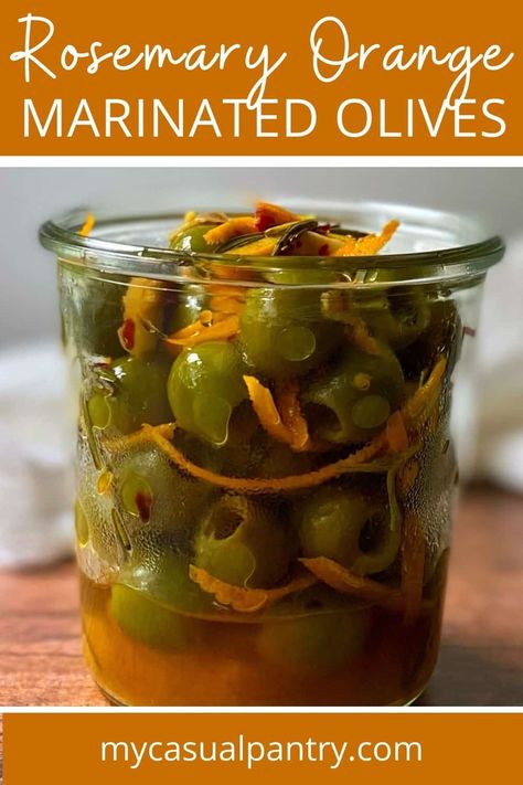 glass jar filled with marinated olives. Warm Citrus Marinated Olives, Citrus Marinated Olives, Green Olives Recipes, Marinated Olives And Cheese, Olive Marinade, Olive Appetizers, Marinated Olives Recipe, Antipasto Platters, Cookout Ideas