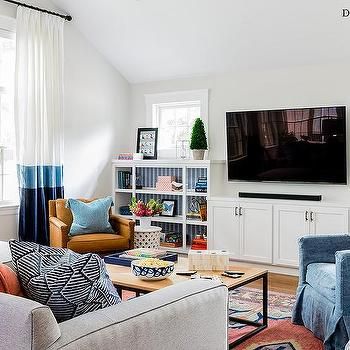 TV Flanked by Built In Shelves with Wallpaper Grey Upholstered Bed, Color Block Curtains, White And Gold Decor, Built In Dresser, Blue Accent Chairs, White Shaker Cabinets, Transitional Living Rooms, Living Room Windows, Living Room White