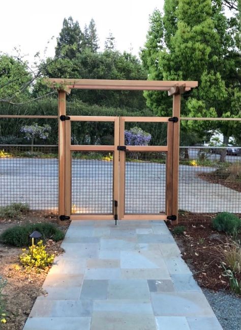 If you have a double gate installed over a concrete or tile walkway, you will likely ask: how do I get the cane bolt to stay in the ground? The easiest way to do it is to drill a simple hole into the concrete, recommended for gate setups where the inactive gate isn't used very often. For frequently-used gates, install a cane bolt that includes a strike plate. This adds a protective layer over the concrete so it doesn't get chipped up. Be sure to have a knowledgeable installer!! 6ft Fence Ideas, Cheapest Fence Ideas, Country Fencing, Aesthetic Fence, Fence Gate Ideas, Simple Fence, Garden Fence Gate, Yard Fencing, Diy Dog Fence