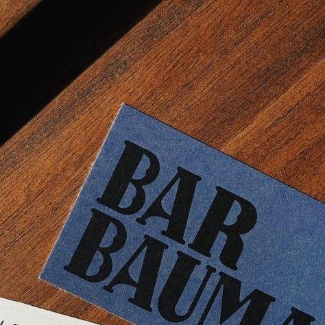 Branding Board on Instagram: "Bar Bauma by @dennis.studio_	⁠ ⁠ "An emblematic Barcelona classic, for over 80 years @barbauma.es has been a meeting place for well-known local writers and creatives.⁠ ⁠ Under the new ownership of @somosesencia.es, great care was taken to maintain the name and the spirit of a bar that became loved by local residents over the decades.⁠ ⁠ With this approach in mind, we redrew the iconic Bauma sign that still sits above the main entrance and made it into the logo. This formed the basis of the identity, alongside a typewriter style typeface used with lined paper for the menus and social media communications.⁠ ⁠ Interior designers @conticert retained and upholstered many of the existing furniture and fittings, breathing new life into the bar while always hinting to Bar Typography, Bar Names, Speakeasy Graphic Design, Speakeasy Branding, Cocktail Bar Branding Design, Cocktail Bar Branding, Bar Branding, Bar Branding Identity, Typography Design Inspiration