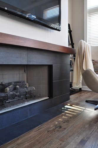 Idea to redo our brick fireplace surround with long narrow black tiles (that I already have!!!) Brick Fireplace Surround, Modern Fireplace Design, Slate Fireplace Surround, Black Fireplace Surround, Fireplace Design Ideas, Basement Fireplace, Slate Fireplace, Natural Stone Fireplaces, Fireplace Tile Surround