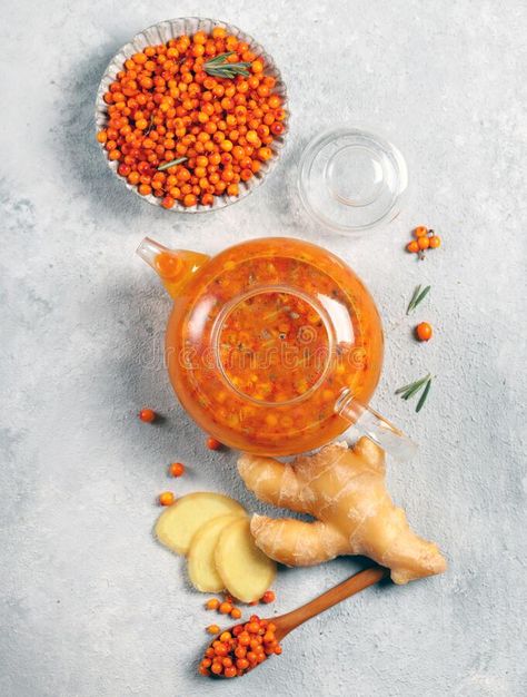 Natural berry tea from sea buckthorn on a light gray background stock photography Light Gray Background, Berry Tea, Sea Buckthorn, View Image, Top View, Gray Background, Floral Designs, Light Gray, Stock Photography