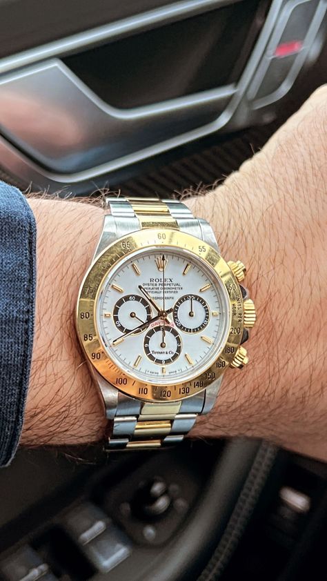 Two tone Rolex Daytona in yellow gold and stainless steel with a white dial and Tiffany & Co. stamp. Please follow us and visit our pages for more 🙏🏻 Rolex Daytona Two Tone, Rolex Daytona Gold, Tiffany And Co, Rolex Daytona, Luxury Watches For Men, White Dial, Luxury Watches, Tiffany & Co., Follow Us