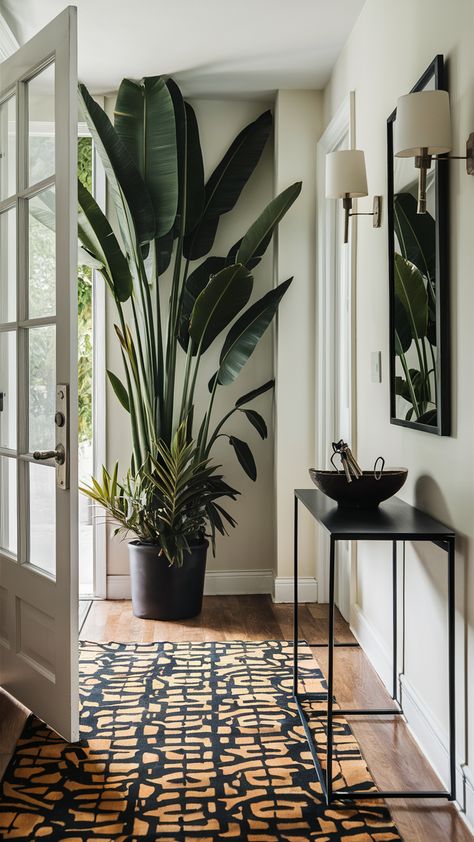 Welcome guests with a stunning entryway that combines tropical plants and sleek IKEA design! A tall tropical plant by the door sets a vibrant tone, while a minimalist console table keeps keys organized in style. Add a bold patterned rug for personality and wall-mounted sconces for a warm glow. This chic and inviting atmosphere is perfect for making a lasting first impression. Explore more ideas to elevate your entrance and create a space that reflects your unique style! #EntrywayDecor #TropicalPlants #IKEAStyle #HomeInspiration #InteriorDesign #WelcomingVibes #ChicHome Entryway Plants Indoor, Chic Entryway, Minimalist Console Table, Ikea Style, Ikea Design, Entryway Inspiration, Patterned Rug, Door Sets, Tall Plants