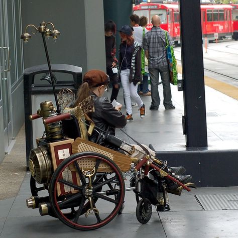 Steampunk Wheelchair I'm going to make this for my friend who is in a wheelchair Steampunk Wheelchair, Wheelchair Costumes, Steampunk Vehicle, Wheelchairs Design, Corset Steampunk, Steampunk Gadgets, Steampunk Items, Steampunk House, Wheelchair Accessories