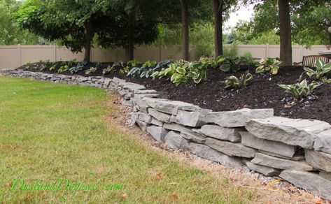 A DIY Stacked Stone Wall – Part 1 – DustandDoghair Stone Garden Wall, Diy Stone Wall, Stone Walls Garden, Stacked Stone Walls, Sloped Yard, Hosta Gardens, Sloped Backyard, Stone Retaining Wall, Landscaping Retaining Walls