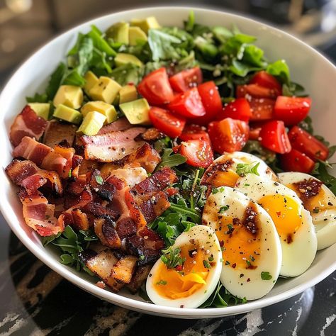 🥗🥓 Dive into a classic Cobb Salad! Packed with flavor and freshness for any meal. #CobbSalad #HealthyChoice Cobb Salad Recipe This hearty salad is a perfect blend of crisp greens, rich toppings, and a flavorful dressing. Ingredients: Romaine lettuce, chopped: 150g Iceberg lettuce, chopped: 150g Cooked chicken breast, diced: 200g Bacon, cooked and crumbled: 100g Hard-boiled eggs, chopped: 3 eggs Avocado, diced: 100g Cherry tomatoes, halved: 100g Blue cheese, crumbled: 50g Chives, chopped: ... Salad Cobb, Big Salads, Perfect Salad Recipe, Classic Cobb Salad, Types Of Lettuce, Cobb Salad Recipe, Eggs Avocado, Different Salads, Healthy Food Menu