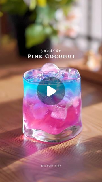 Baby's Homecafe & cook on Instagram: "Asmr Pink coconut with blue curacao lemonade

It's pink, glittery, bubbly and majestic! With a hint of ocean blue🌊 This delicates cherry blossom syrup is not only beautiful to look at, but also a great addition to your mocktail! Its sweet, sour with a subtle floral notes.

Ingredients:
15ml sakura/cherry blossom syrup
coconut water
Mix
Ice cubes
Sparkling water / soda

15ml blue curacao syrup
Coconut water
Freshly squeezed lemon juice
Shake and strained

Bahan:
15 ml sirup bunga sakura
Air kelapa
Mix
Es batu
Sparkling water / soda

15ml sirup blue curacao
Air kelapa
Perasan lemon
Shake dan saring

#refreshingdrink #homecafe #easyrecipe #mocktail #lemonade  #cinematic #calmvibes #metime #cocktail #mojito #summerdrink #asmr 
#resepminuman #coconut #blue Pink And Blue Alcoholic Drinks, Mocktail Lemonade, Blue Alcoholic Drinks, Cocktail Appetizers, Squeezed Lemon, Air Kelapa, Water Mixes, Blue Curacao, Sakura Cherry Blossom