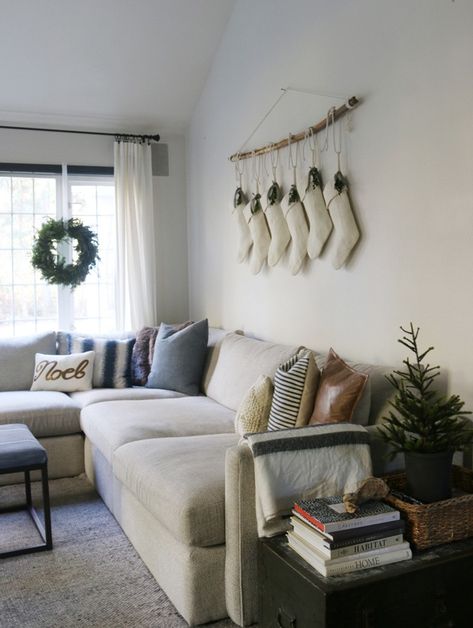 Christmas in the family room | https://jonesdesigncompany.com/decorate/christmas-in-the-family-room/ Christmas Decor Above Couch, Above Couch Christmas Decor, Behind Couch Christmas Decor, Aesthetic Christmas Living Room, Decor Over Couch, Wall Decor Behind Couch, Decor Above Couch, Wall Decor Above Couch, Christmas Living Room Ideas