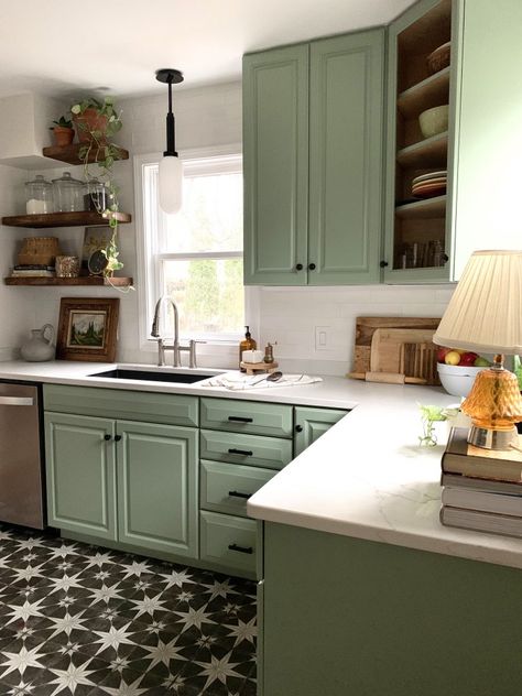 Charming and Cheerful Kitchen Renovation White Countertops Kitchen Green Cabinets, Galley Kitchen Ideas Green, Pretty Kitchen Colors, Green White Kitchen Ideas, Small Kitchen Remodel Green, Retro Kitchen Renovation, Simple Green Kitchen, Sage Green Kitchen Cabinets Tile Floor, Light Grey And Green Kitchen