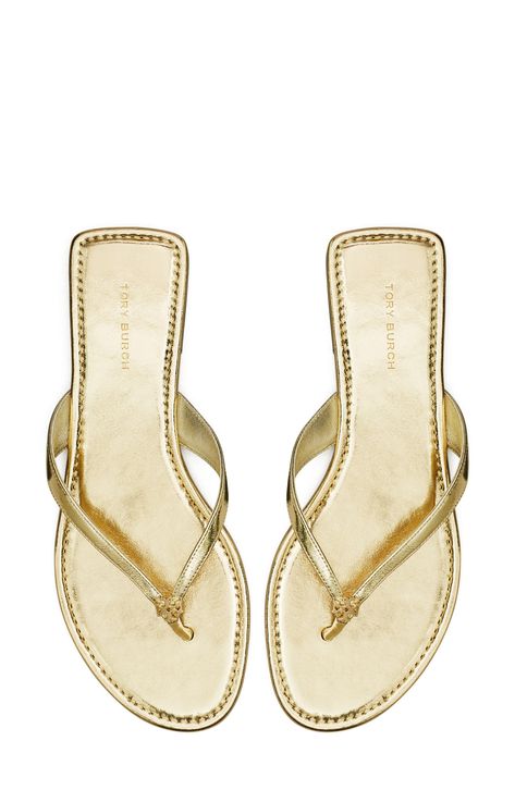 Signature logo hardware details the toe post of a versatile flip flop that will complement your warm-weather style. Flat sole Leather or synthetic upper/leather lining and sole Imported Dominican Outfits, Viva Forever, Gold Flip Flops, Tory Burch Flip Flops, Things I Need To Buy, Pretty Sandals, Dressy Shoes, Sandals Flats, Gold Flats