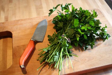 Chopping herbs isn’t a new skill to any cook in the kitchen, but we’ve recently come across a method that cuts down the time it takes to pick leaves off stems. This is especially useful for cilantro and parsley, where it is often necessary to use just the leaves and not the stems. This is a simple trick, not one that will change your life, but it can speed up your herb prep quite a bit! Here’s what we do. Fish Breakfast, Kitchen Tricks, Healthy Foodie, Food Prep, Fresh Cilantro, Kitchen Cooking, Food Tips, Baking Tips, Cooking Kitchen