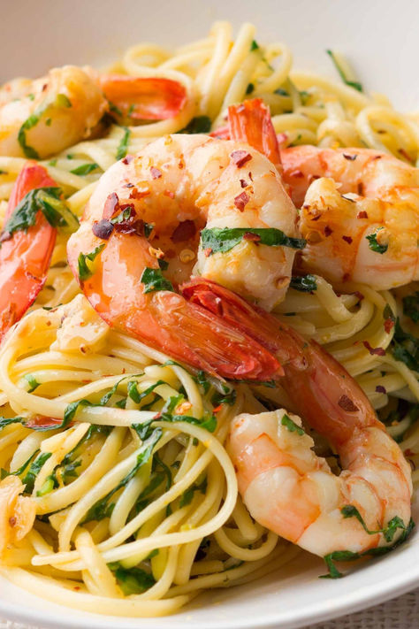 One of the greatest pastas Italy has created is also one of its simplest: the glorious aglio e olio, pasta with just garlic, olive oil and chilli. And yet, it appears you can build on perfection. One of our favourite pasta recipes on taste.com.au is linguine with prawns, which riffs on this classic. Plump king prawns are seared in the oil mixture and a handful of fresh rocket leaves are tossed with the pasta at the last moment. Chilli Prawn Pasta, Garlic Prawn Pasta, Olio Pasta, Prawn Linguine, Rocket Leaves, King Prawns, Linguine Recipes, Favorite Pasta Recipes, Aglio E Olio