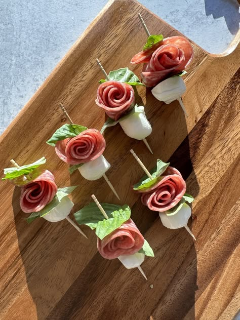 Salami Roses Fairy Party Food Savory, Garden Party Appetizer Ideas, Tea Party Entrees, Rose Themed Party Food, Salami Rose Caprese Skewers, Rose Food Ideas, Floral Themed Appetizers, Flower Shaped Snacks, Floral Charcuterie Board Ideas