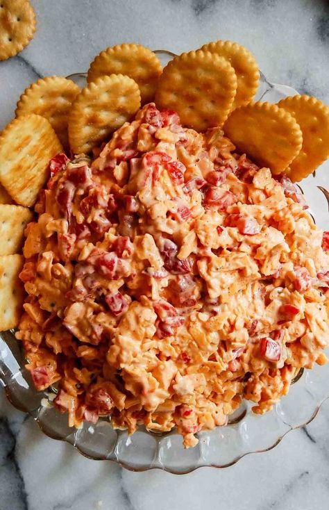 Classic Southern flavor is just a recipe away with this Old Fashioned Pimento Cheese! Serve it as a dip, spread for sandwiches, or in grits, sausage balls, and pasta salad. Ideal for pinwheels and tomato pie, and perfect for grilled cheese sandwiches and burgers. This easy, retro recipe adds a touch of tradition to your kitchen. Discover more dips and spreads at www.frontrangefed.com. Pimento Cheese Ball, Old Fashioned Pimento Cheese Recipe, Southern Pimento Cheese Recipe, Southern Pimento Cheese, Tasty Meatloaf Recipe, Pimento Cheese Recipe, Meatloaf Glaze, Dips And Spreads, Pimento Cheese Spread