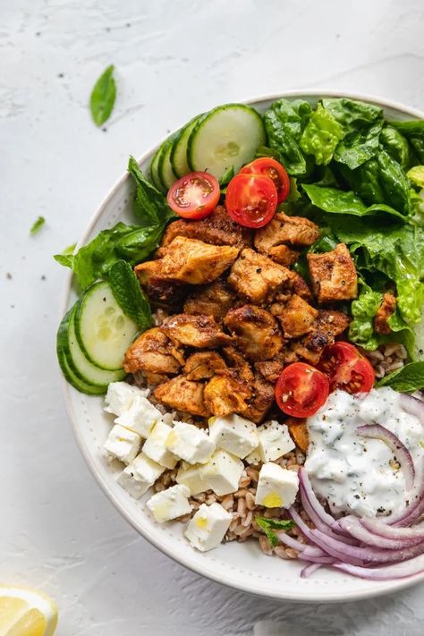 It's just like a chicken shawarma pita - but deconstructed! These Chicken Shawarma Bowls are made with a farro base, then topped with incredibly flavorful marinated chicken, shredded romaine, shaved red onion, cucumbers, cherry tomatoes, cubes of feta, fresh mint, and a super quick tzatziki sauce! #chickenshawarma #bowls #easymeal #tzatziki #healthy Quick Tzatziki Sauce, Chicken Shawarma Pita, Shawarma Bowl, Coconut Butter Recipes, Chicken Shredded, Romaine Salad, Power Bowls, Chicken Shawarma, Tzatziki Sauce