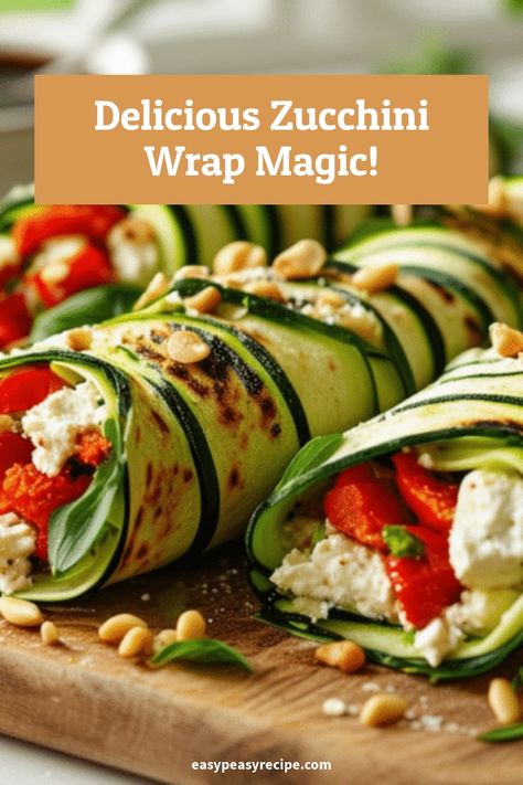 Zucchini wraps filled with roasted red peppers, feta cheese, and fresh herbs on a wooden board. Zucchini Wraps Recipes, Zucchini Wraps, Vegetable Lunch, Wraps Recipes, Easy Zucchini Recipes, Easy Peasy Recipes, Wrap Recipe, Flavorful Vegetables, Healthy Zucchini