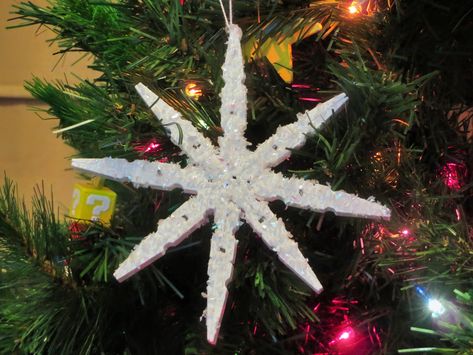 These snowflakes are hand crafted using clothes pins! Such a pretty ornament for your tree. You could also use it as a gift tag or decoration on a fancy wrapped gift for that someone special on your list. Size: 6" High x 6" Wide Handmade in America Snowflake Clothespin Ornament, Clothes Pin Snowflakes, Clothes Pin Ornaments, Clothespin Ornaments, Wooden Christmas Tree Ornaments, Snowflake Christmas Ornaments, Dreamy Christmas, Clothespin Diy Crafts, Whimsical Christmas Tree