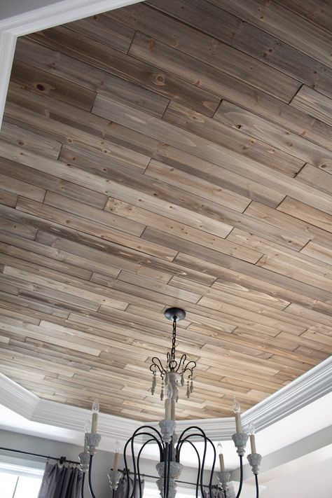 Learn how to make your ceiling a focal point with this easy guide to installing a wood planked ceiling. Tongue and groove wood planks make this DIY a cheap and easy project that you can tackle in a weekend. Head over to the blog for all the details. Cheap Ceiling Covering Ideas, Dining Room Ceiling Ideas, Peru House, Planked Ceiling, Ceiling Makeover, Decorative Ceiling Panels, Groove Ceiling, Ceiling Diy, Ceiling Remodel