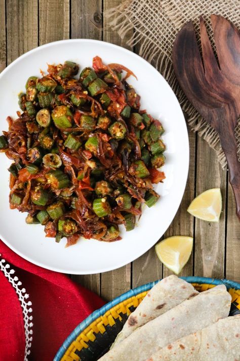 Okra and Onion Curry (Bhindi Pyaaz, or bhindi do pyaza) is a traditional Pakistani and Indian okra curry recipe that consists of stir-fried okra enveloped in a savory onion and tomato curry. This is naturally gluten-free and vegan curry that's been tested-and-perfected to ensure a perfectly balanced taste. via @pinterest.com/teaforturmeric Bhindi Curry Recipe, Indian Okra, Gluten Free Indian Food, Bhindi Masala Recipe, Onion Curry, Fresh Okra, Okra Curry, Bhindi Masala, Pakistani Dishes