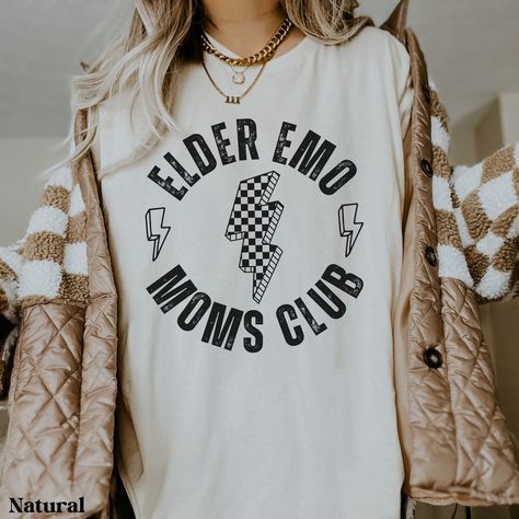 This comfy shirt is the perfect gift for the elder emo in your life. You know, the one that has never stopped loving those old pop punk hits and still goes to every reunion concert/festival they can find. Maybe you're the elder emo that can't get enough of that nostalgia. Gift yourself with this comfy shirt and go jam out. Each shirt is custom made at the time you order it. Please note: Colors may appear slightly different in-person due to computer/phone screens.  SIZE: ❤ This is a regular unise Emo Concert, Punk Rock Shirts, Elder Emo, Scene Shirt, Emo Phase, Punk Shirt, Mama Style, Comfy Shirts, Concert Shirts