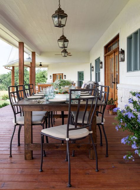 Large outdoor dining table and chairs on a covered porch in Texas Texas Front Porch, Southern Beach House, Beach House Porch, Outdoor Gathering Space, Houston Interior Designers, Outdoor Gathering, Texas Ranch, Live Edge Coffee Table, Open Concept Floor Plans