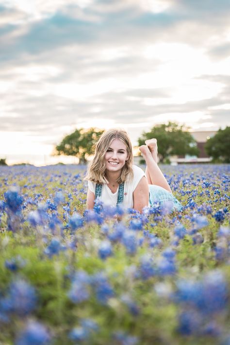 Senior Pictures in Bluebonnet Field Photo Ideas In A Field, Blue Bonnet Picture Ideas, Kids Bluebonnet Pictures, Blue Bonnet Photoshoot Outfits, Senior Pics Wildflowers, Pictures In Fields Photo Ideas, Bluebonnet Photoshoot Family Pics, Senior Picture Ideas Field Of Flowers, Bluebonnet Senior Pictures