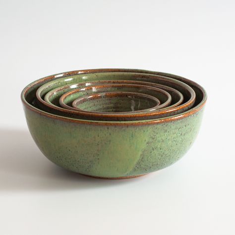 Chop, cube, dice, and mash, these nesting bowls are the perfect kitchen addition and a culinary dream! Every hand-thrown bowl is simply ideal for food prep and all of your serving needs. Each stoneware piece is made individually and will vary in shape, color, and size. Detail Set of 5: Salt/Sauce: 4 inches x 1.75 inches XS Bowl: 5.25 inches x 2.25 inches Small Bowl: 6.5 inches x 2.5 inches Med Mixing Bowl: 7.5 inches x 3 inches Large Mixing Bowl: 8.75 inches x 3.5 inches Made in the USA Care Ins Ethical Wedding, Kitchen Addition, The Perfect Kitchen, Wedding Gift Registry, Wheel Thrown Pottery, Mixing Bowls Set, Perfect Kitchen, Nesting Bowls, Pottery Sculpture