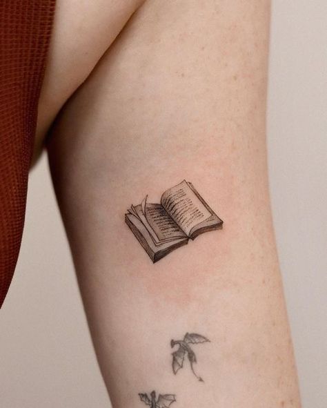 Books Related Tattoos, Tattoo Of A Book, Book Tattoo Inspiration, Bird And Book Tattoo, Book Semicolon Tattoo, Creative Book Tattoos, Tiny Nerd Tattoo, Literature Inspired Tattoos, Cool Book Tattoos