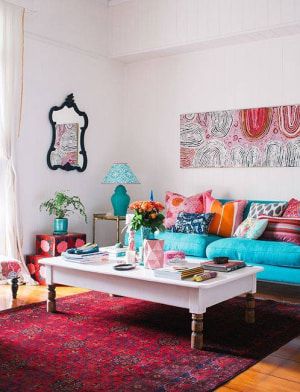 13 Bright Paint Colors For Small Spaces | Domino Sofa Turquoise, Turquoise Sofa, Bright Paint Colors, Bold Living Room, Turquoise Room, Teal Sofa, Blue Rugs, Room Photo, Colourful Living Room